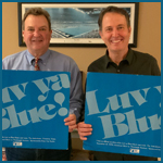 Joe Pogge and Jim Schmidt holding original Luv Ya Blue flashcards